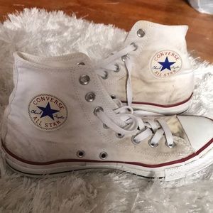 White chuck Taylor’s. White. Have nice worn look